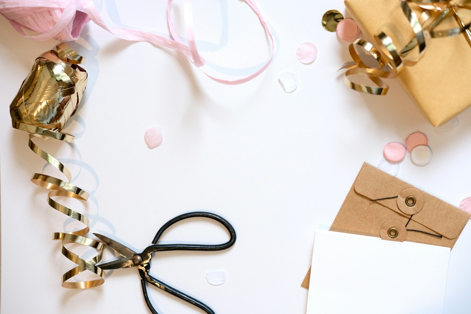 Gift wrapping supplies with ribbon and confetti